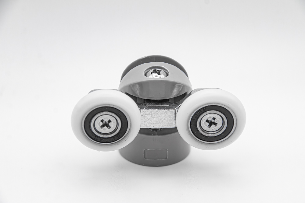 Juego de rodamientos doble articulado con soporte de nylon para mampara de ducha. Tornillos M4, diámetro rueda 23 mm. RAN (2 unidades)